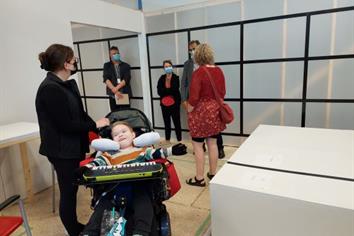 family touring mock-up of patient suites