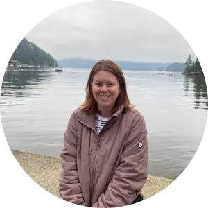 Smiling woman by the ocean