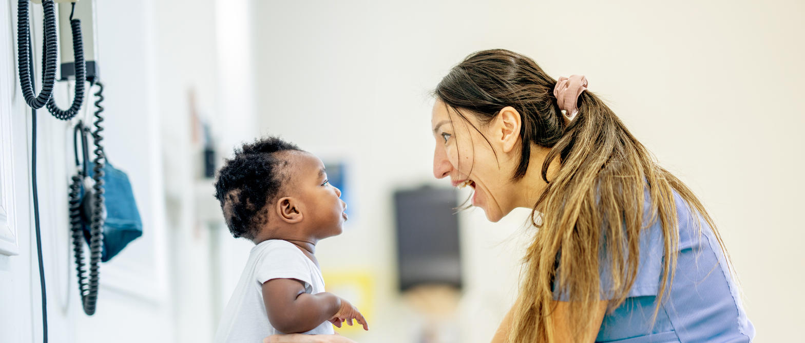 A nurse playing with an infant patient in BC Children's Hospital