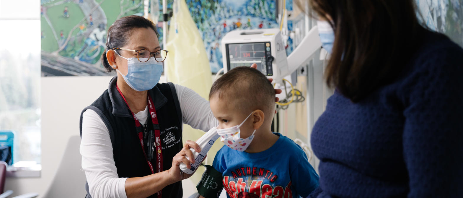 Nurse practitioner with child and parent