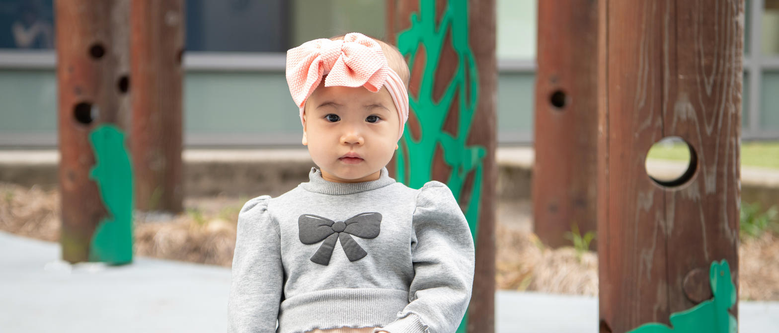 Little girl in outside play space