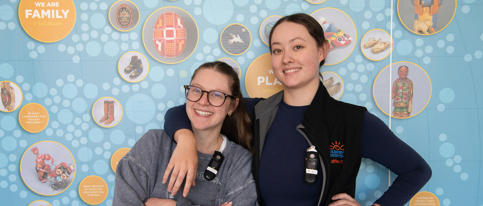 Two nurses pose for a photo in the BC Children's Hospital hallway