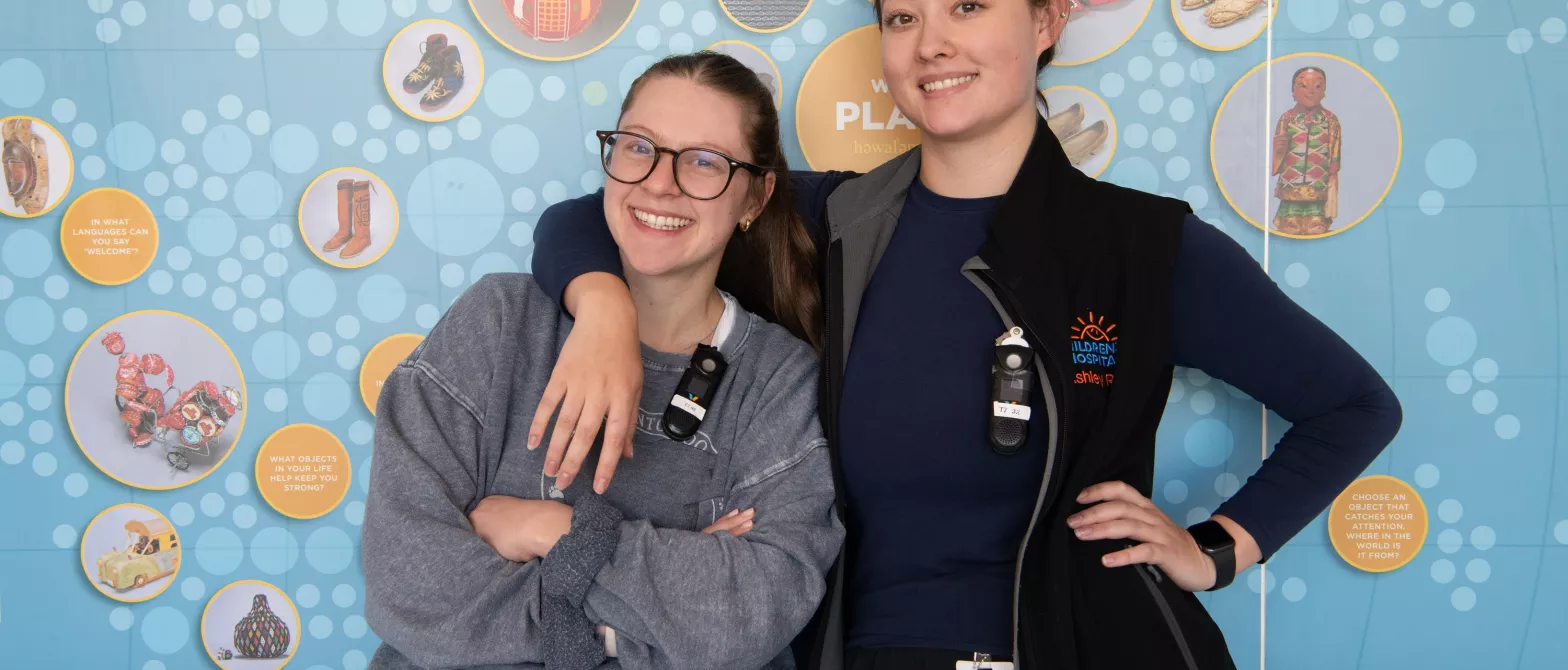 Two nurses pose for a photo in the BC Children's Hospital hallway