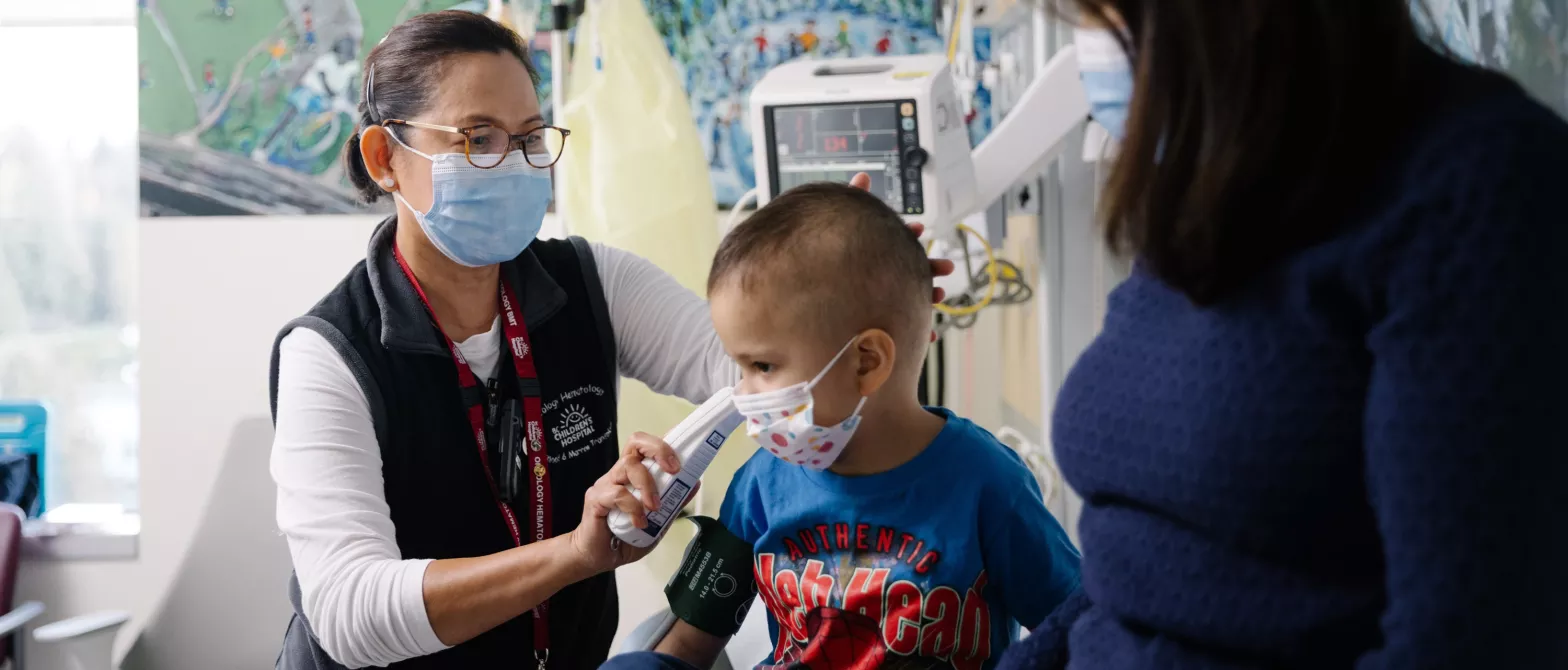 Nurse practitioner with child and parent