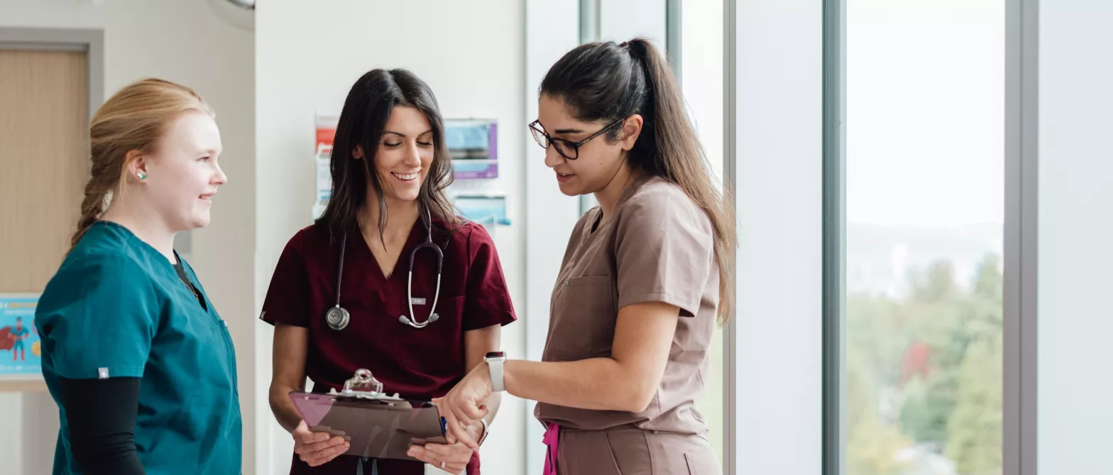 Three nurses having a conversation
