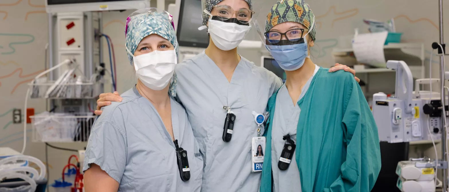 Three nurses wearing face masks