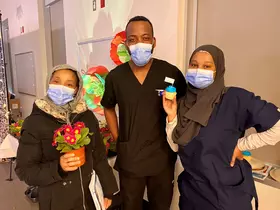 BCCH housekeepers posing with plants and a cupcake