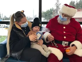 Santa meeting a baby at BC Children's hospital