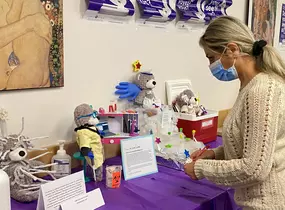 A person votes on the build a lab bear contest entries