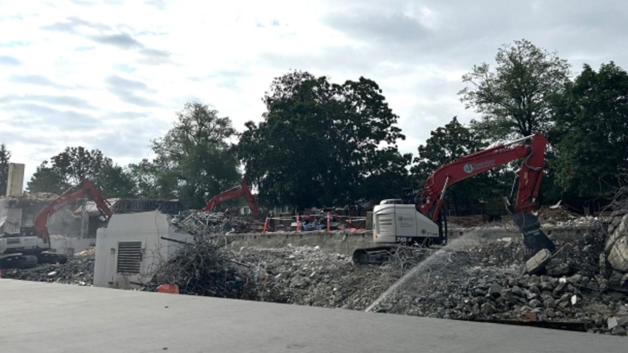 A crew crushing concrete in the old Sunny Hill building location