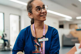 An occupational therapist helping a patient with a brace