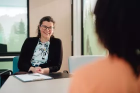 A psychologist meeting with a parent