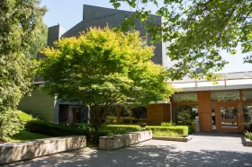 Exterior of a building with green trees outside