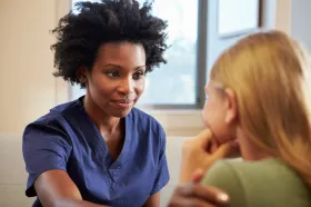 A mental health nurse working with a child patient at BC Children's Hospital