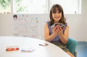 A child playing a card game in BC Children's Hospital