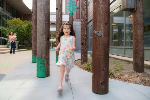 A child playing in the Flavelle Family Wellness Park