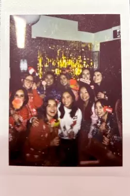 A polaroid of a T7 Professional Practice team party