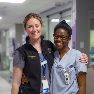 A new nursing graduate posing with a nurse at BC Children's Hospital