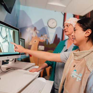 Hospital staff looking at a medical image on a screen