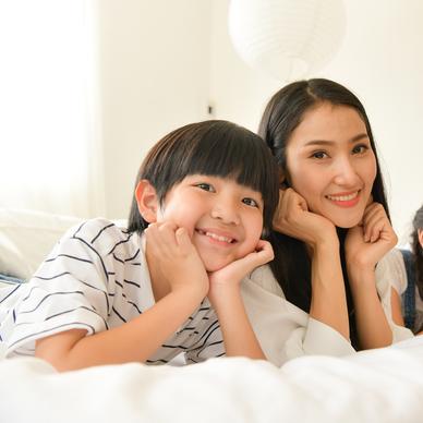 Mother and two children smiling
