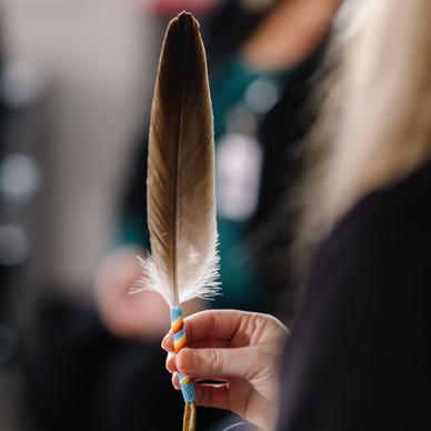 Hand holding feather
