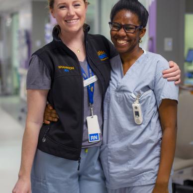 A new nursing graduate posing with a nurse at BC Children's Hospital